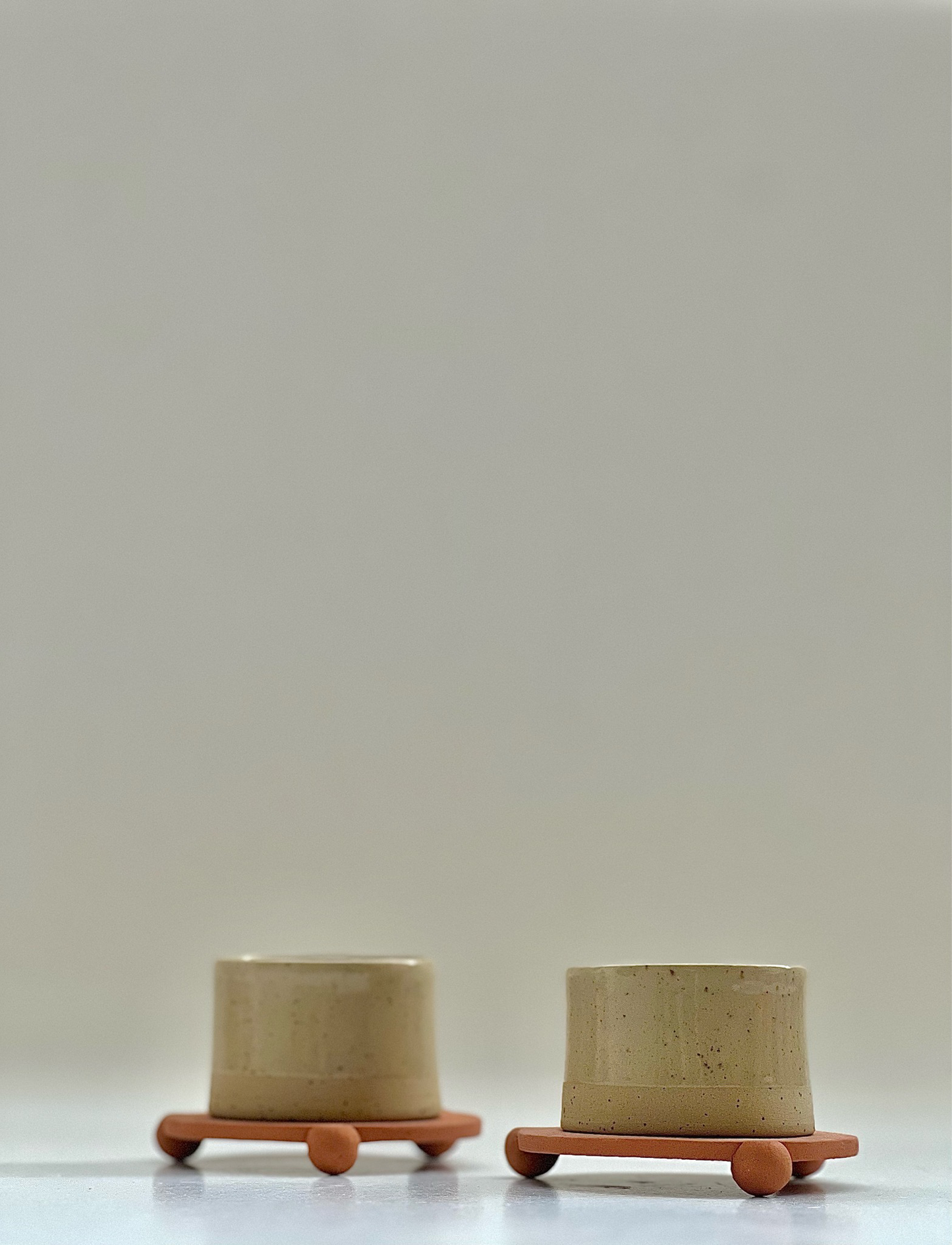 3 oz handleless cup with terracotta ball legs saucer