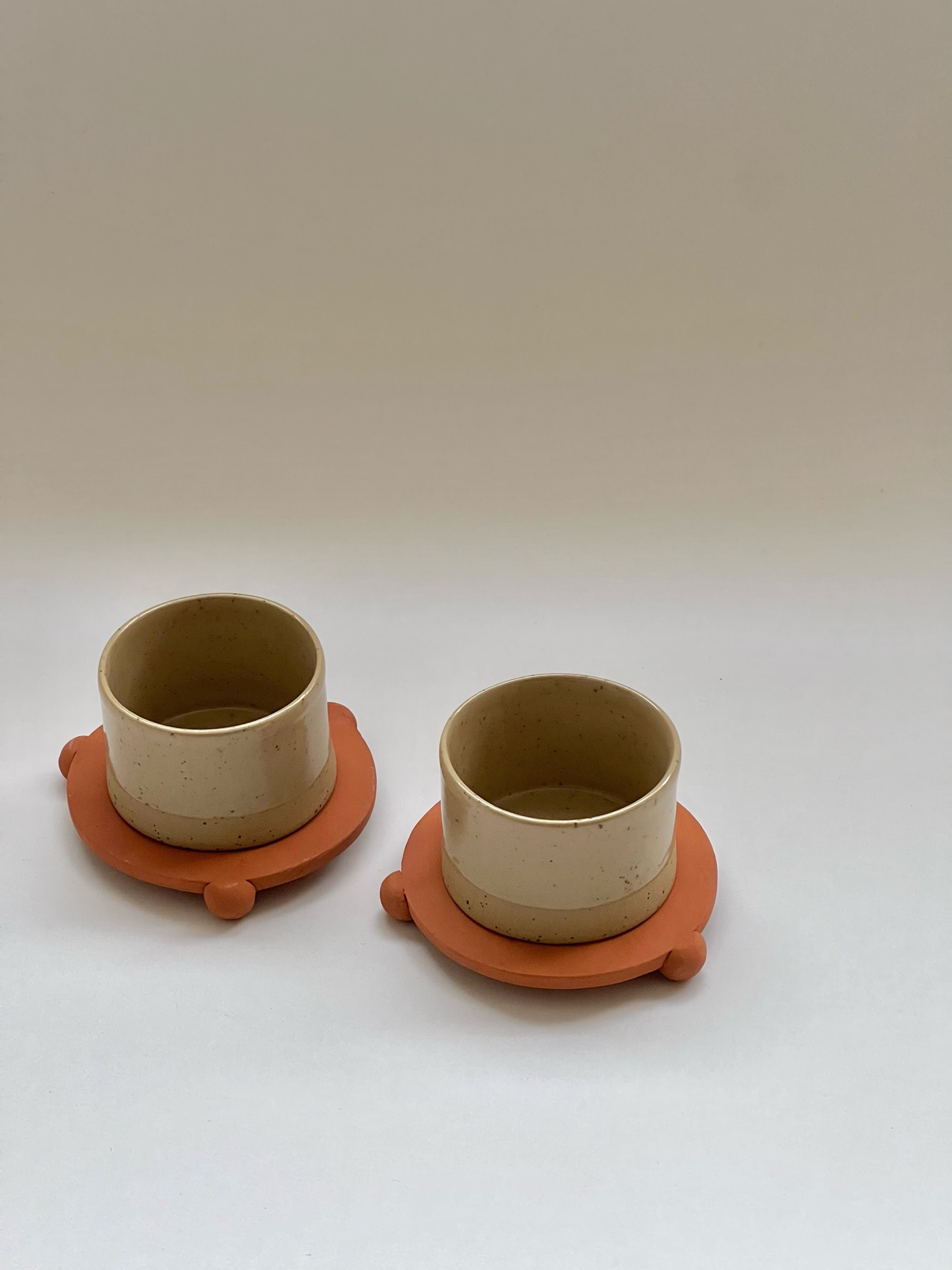 3 oz handleless cup with terracotta ball legs saucer