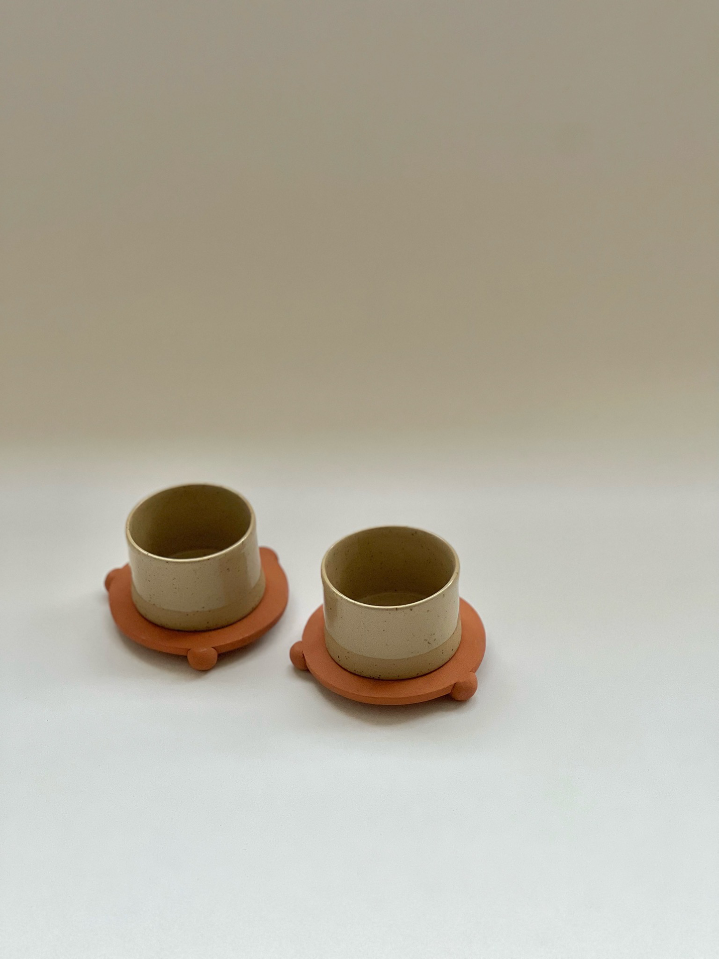 3 oz handleless cup with terracotta ball legs saucer