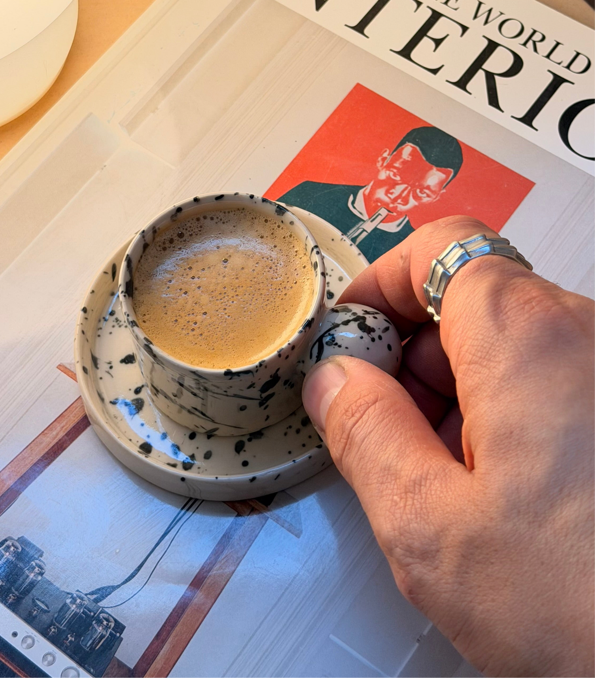Handmade black splash ball handle espresso cup and saucer by Doppiocotto, London