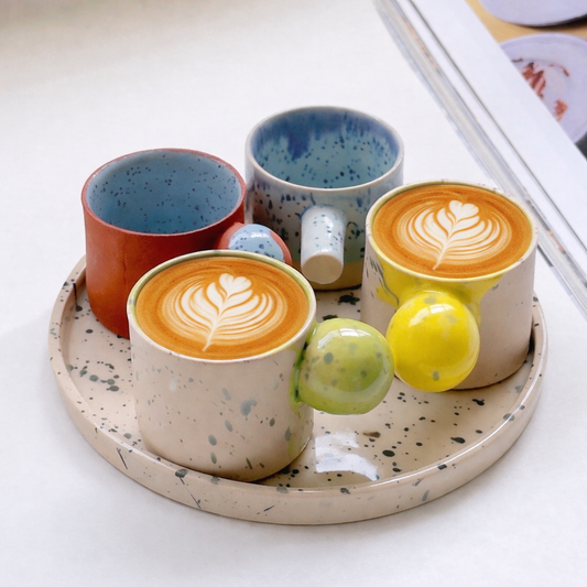 Artistic handmade stoneware espresso cup set with black splashed tray