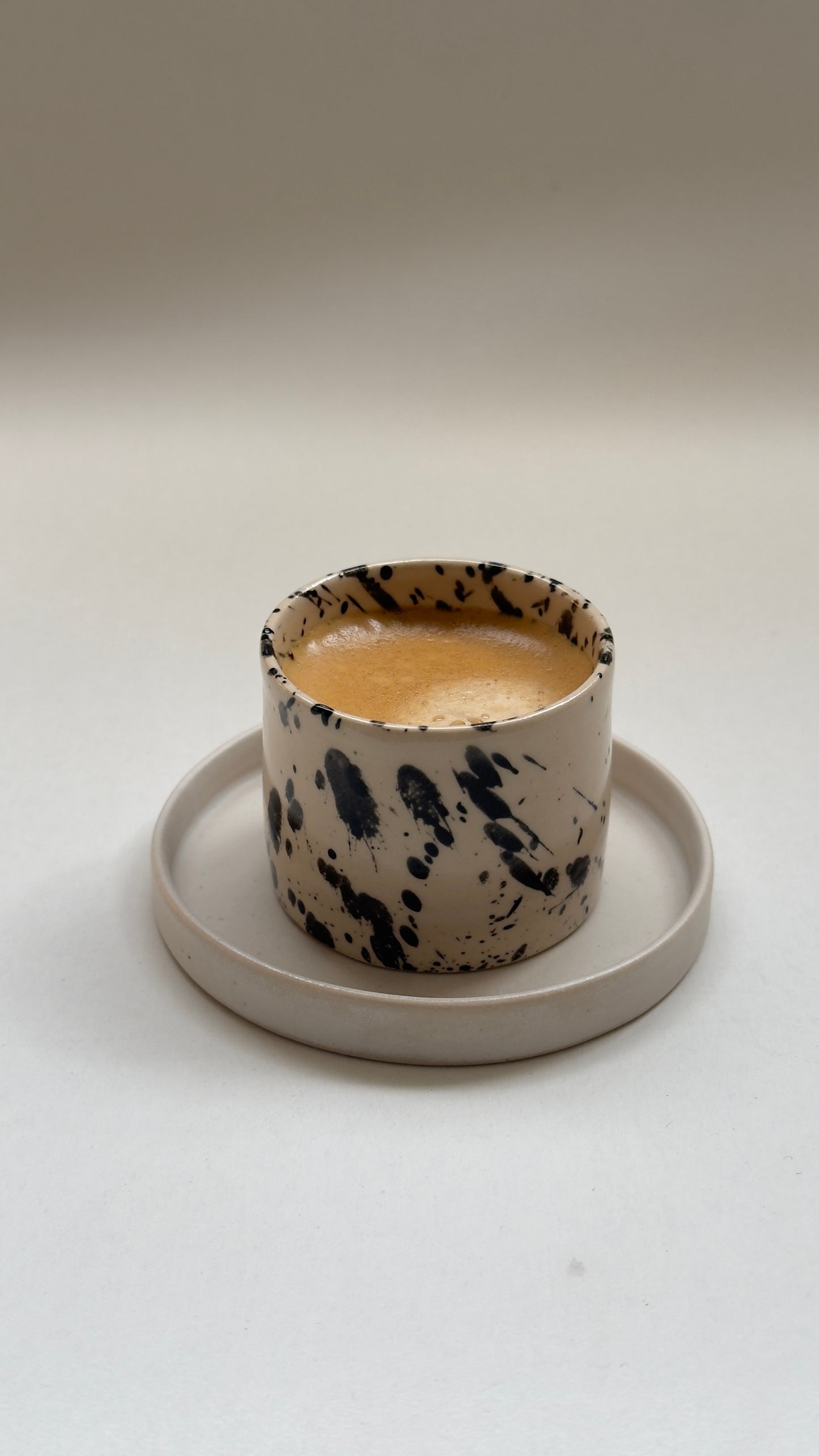 Close up of handmade stoneware espresso cup texture and glaze