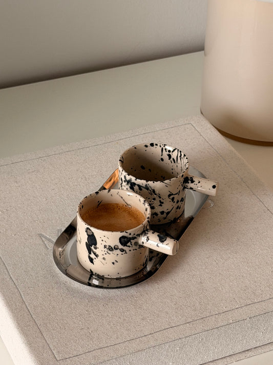 Set of two handmade black splash stoneware espresso cups