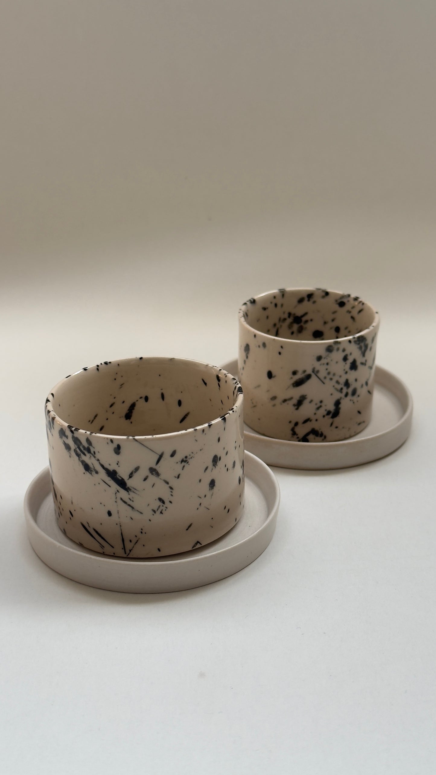 Handmade handleless espresso cup and saucer styled for specialty coffee