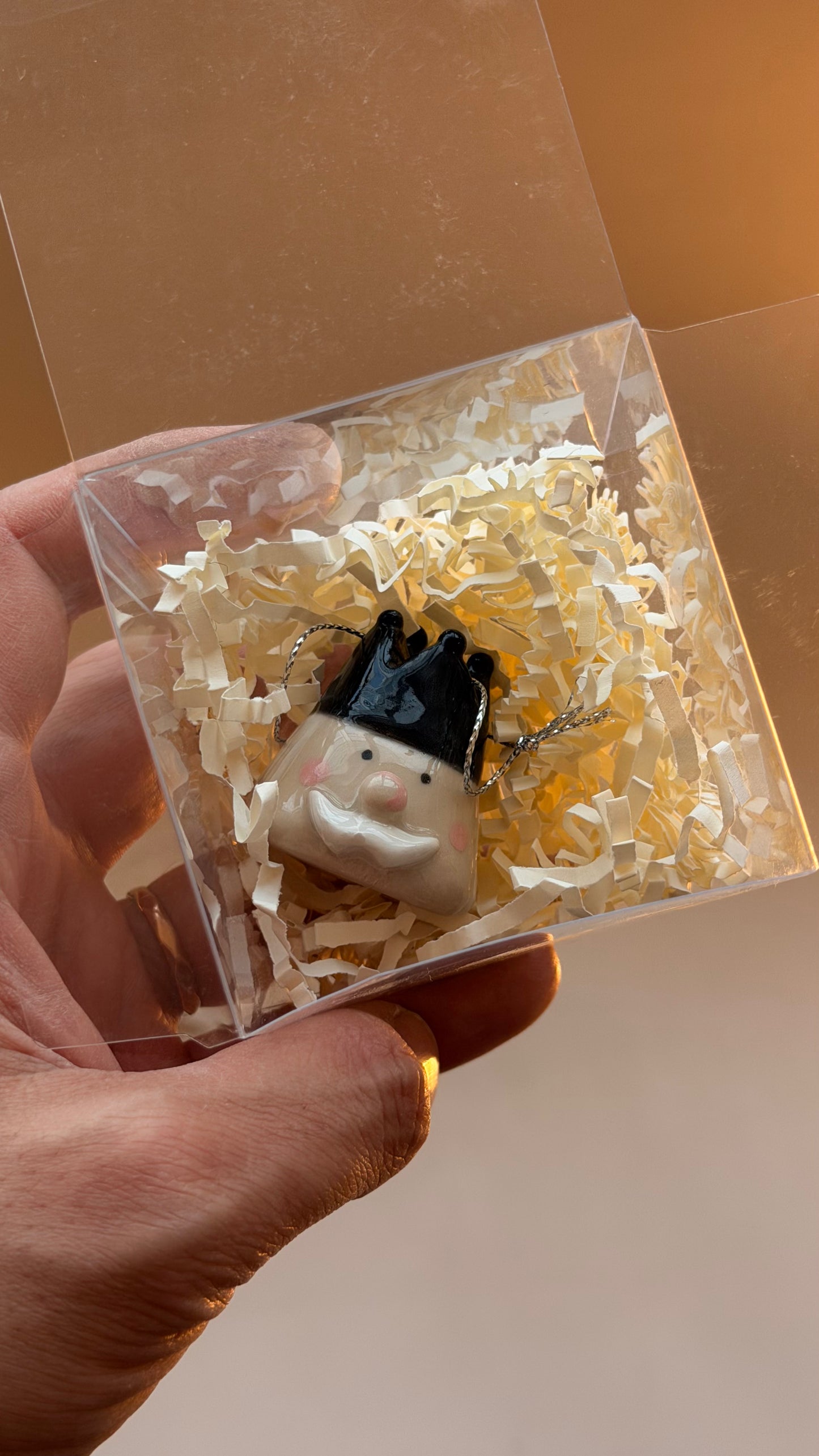 Nutcracker and Santa heads handmade with string for hanging on the Christmas tree