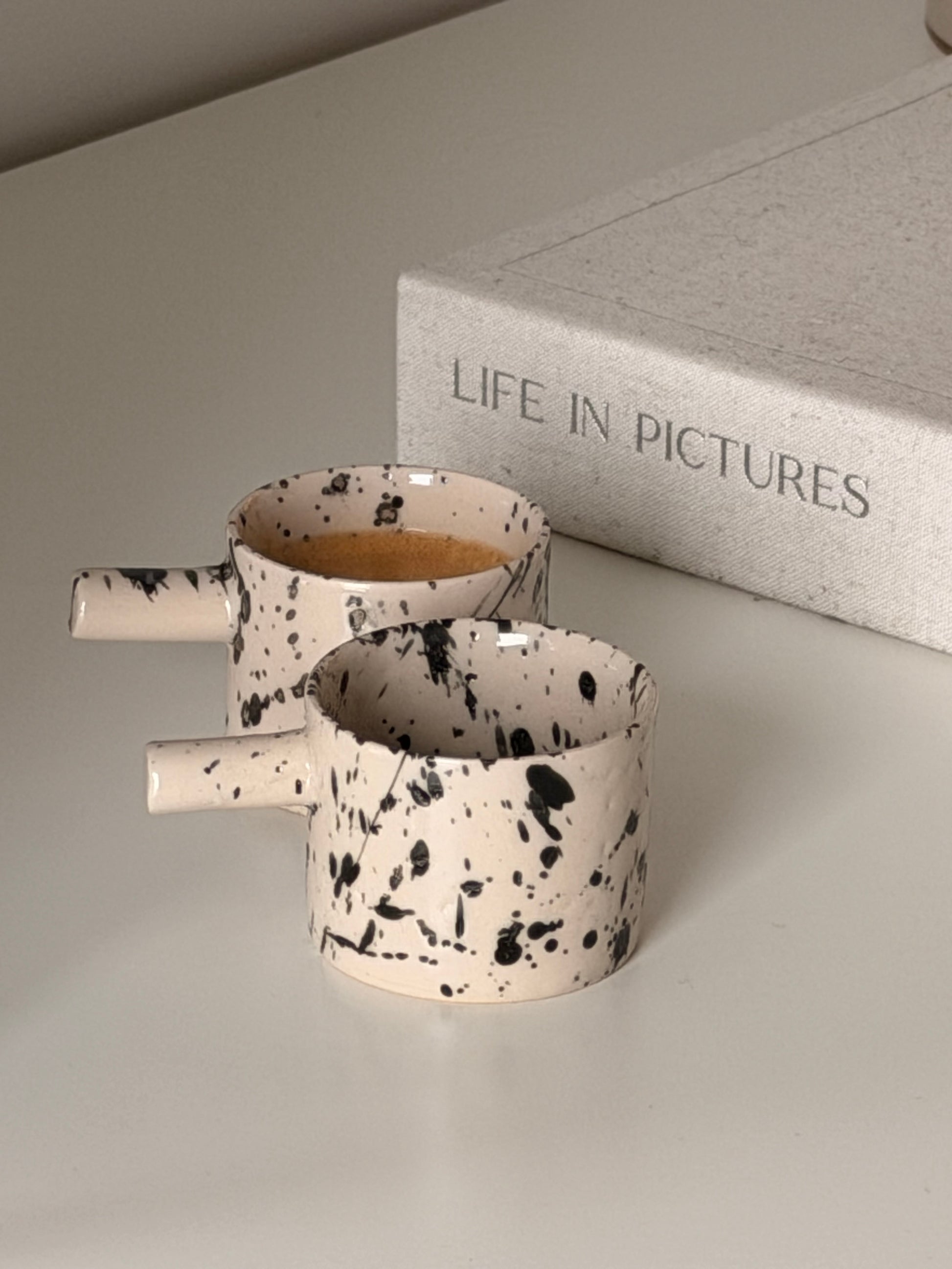 Handcrafted British stoneware espresso cups with unique glaze pattern