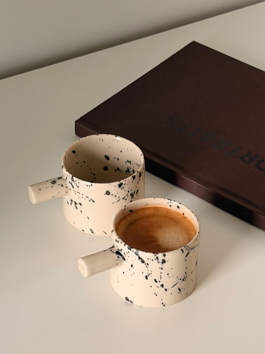 Detail of handmade stoneware espresso cup texture and glaze