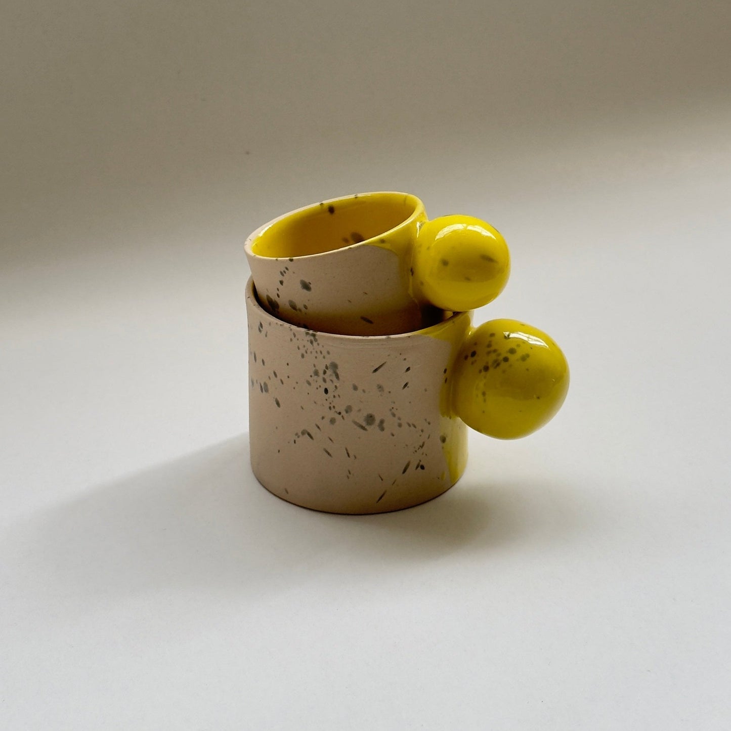 Small batch ceramic cup and saucer set with soft green glaze