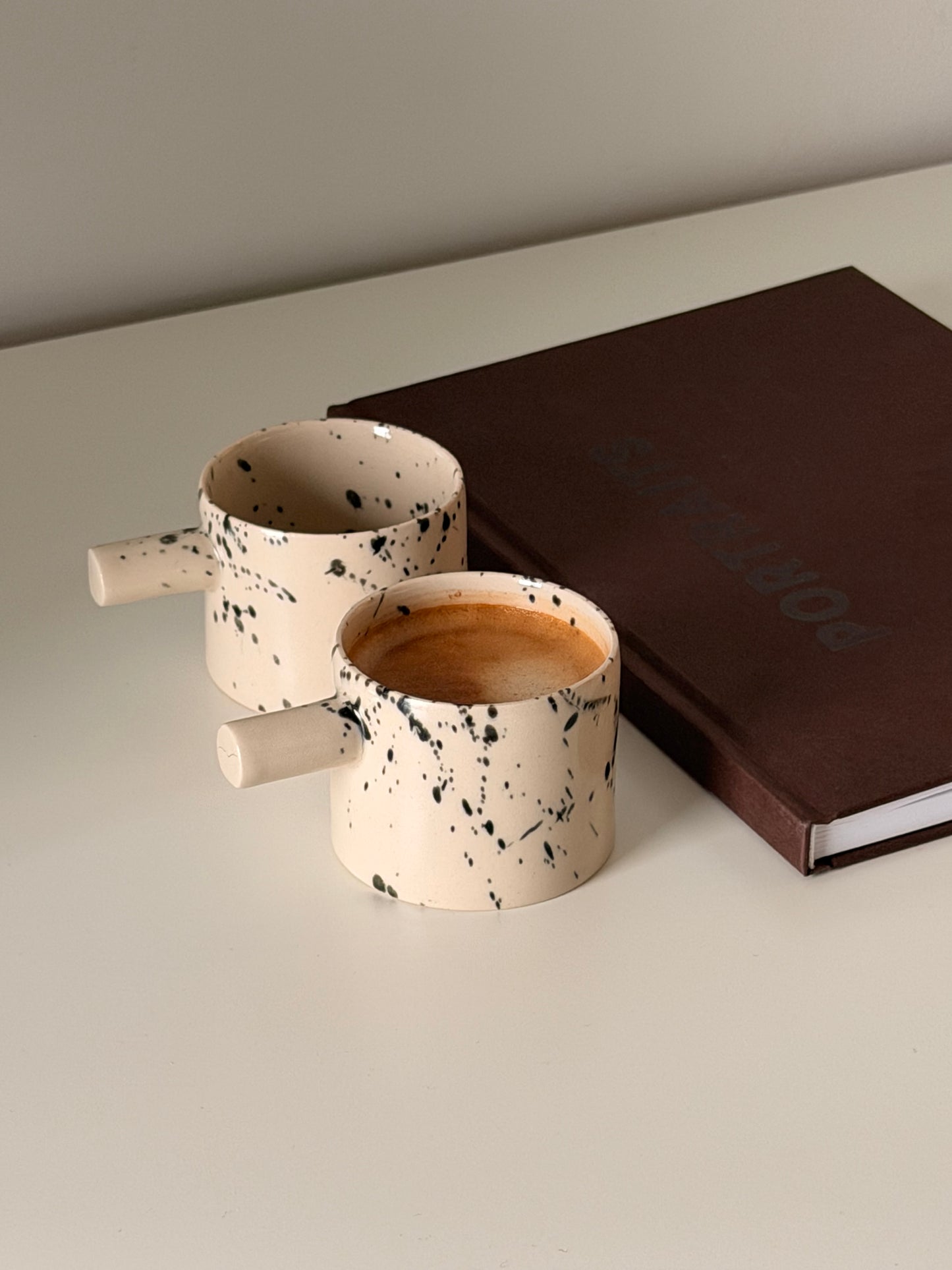 Small batch speckled pottery espresso cups with handles