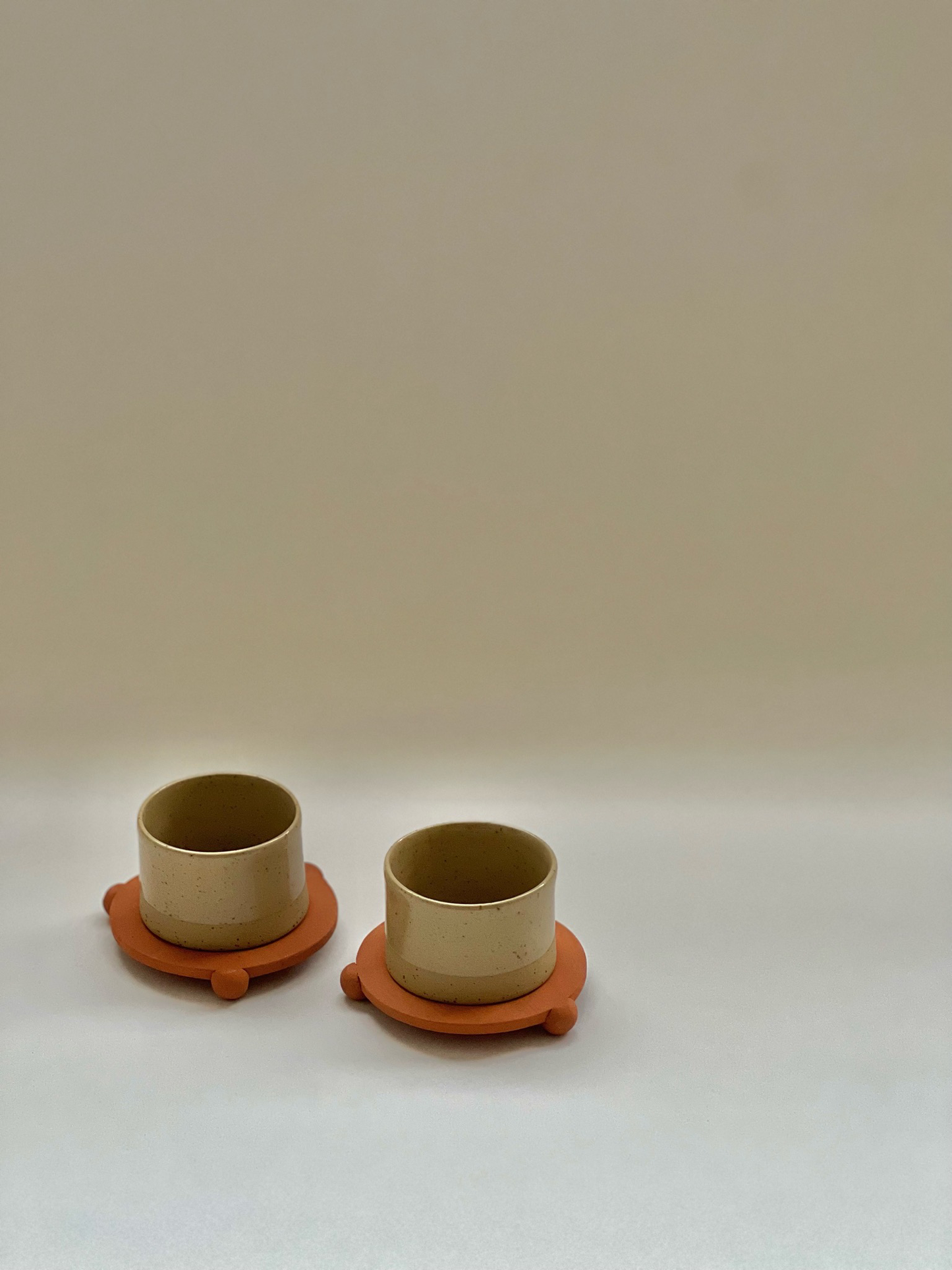 3 oz handleless cup with terracotta ball legs saucer