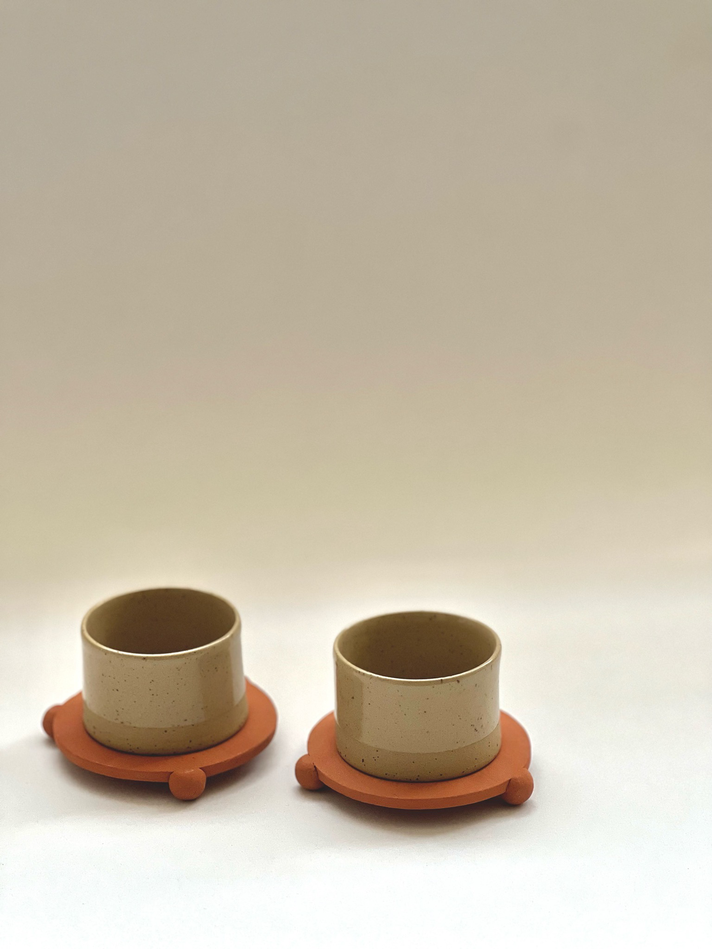 3 oz handleless cup with terracotta ball legs saucer